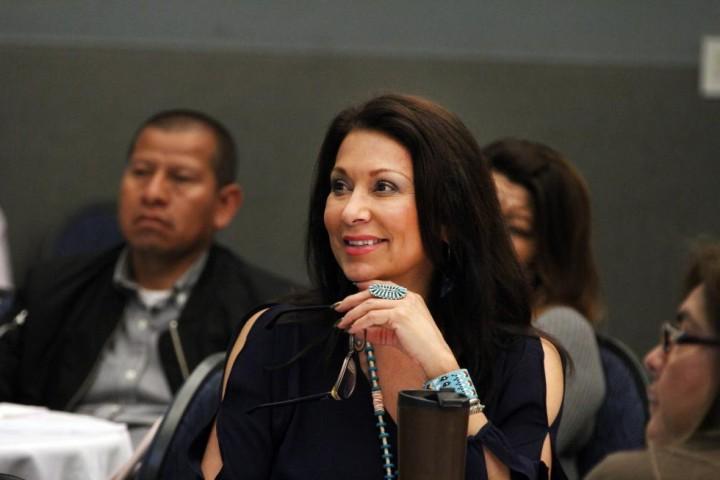 A mom smiling as she attends a Cal State LA parent program.